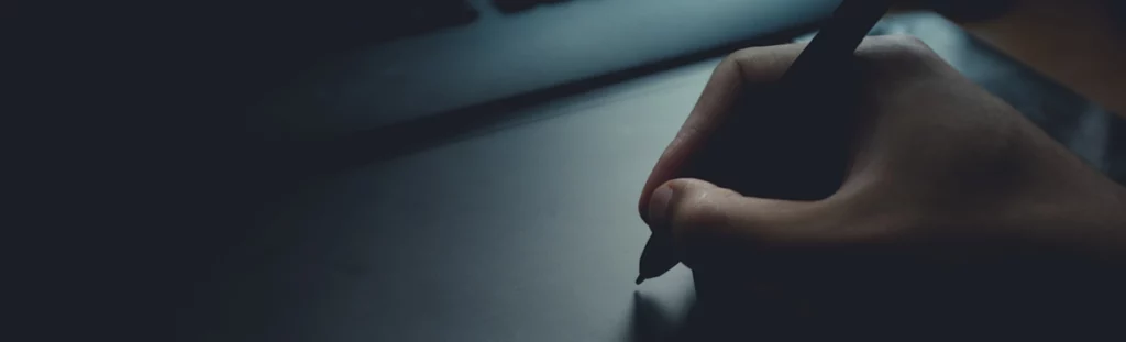 A web developer using a sketching program to design a website